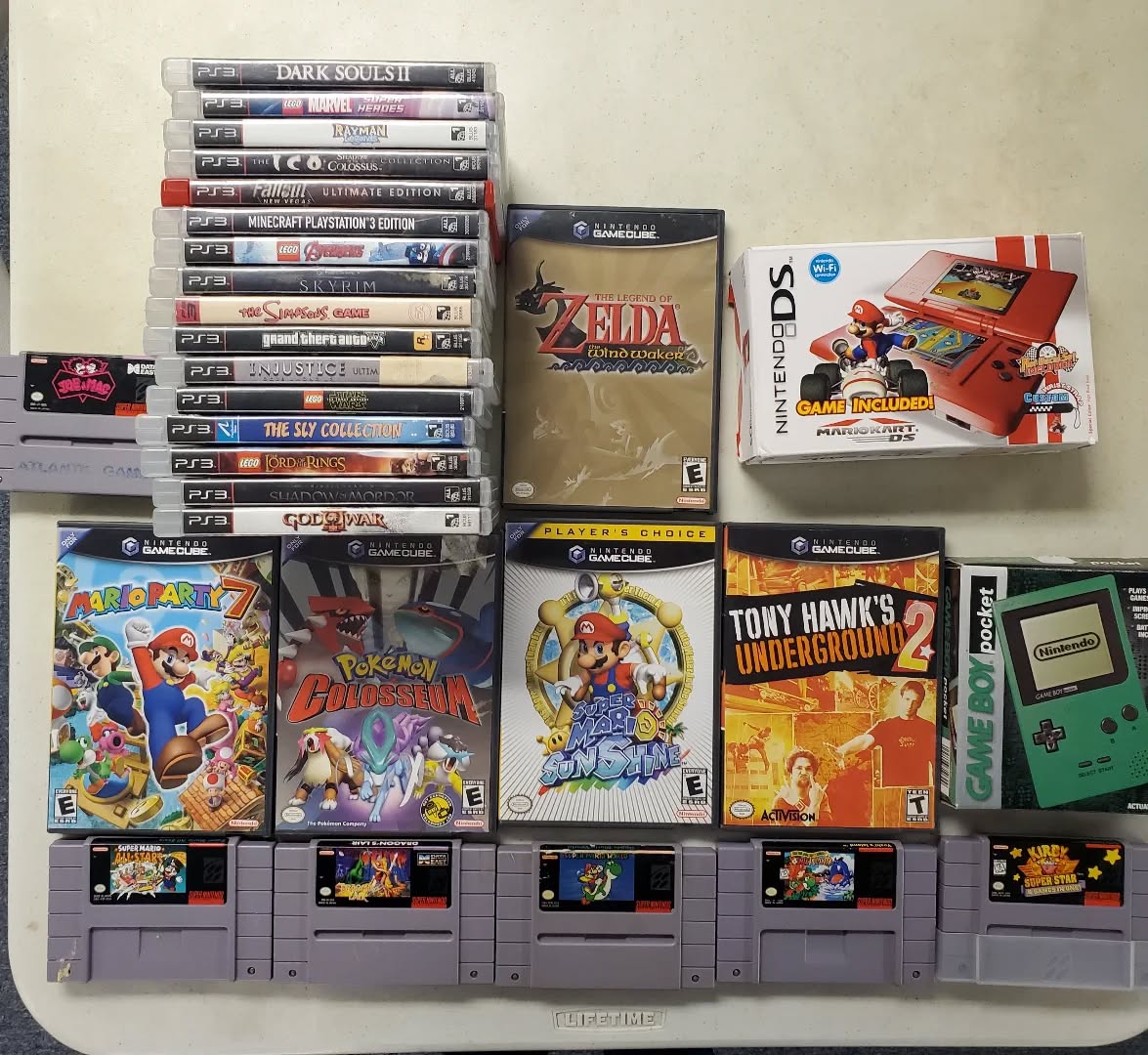 Stacks of retro and current-gen video games with comics in the background